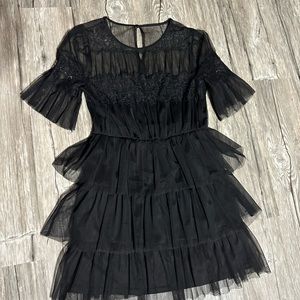 black ruffle dress fits a large or medium, high quality worn once